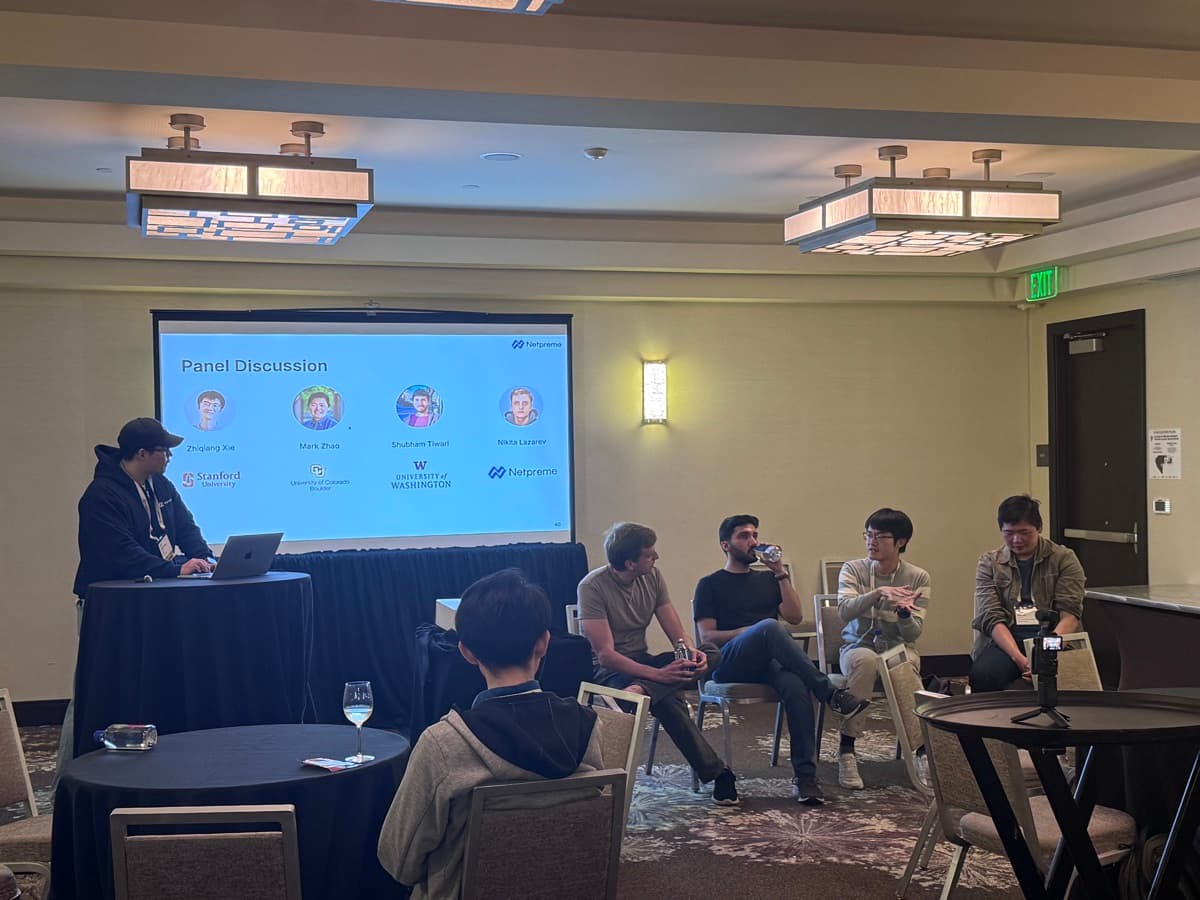 A Netpreme panel discussion in front of a seated audience
